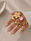 Elegantes Vintage Ring-Set in Gold mit rosafarbenen Steinen & Blütendesign